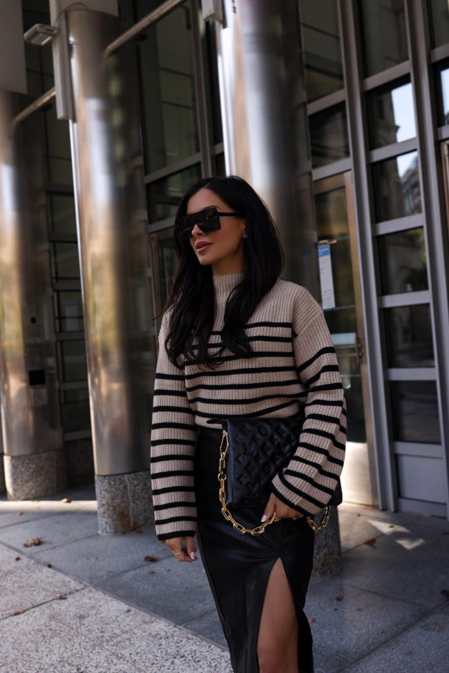 fashion blogger wearing the stripe sweater trend for fall