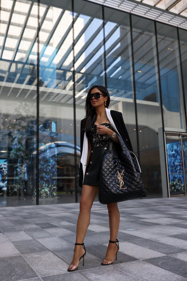 fashion blogger mia mia mine wearing a lace corset and leather shorts
