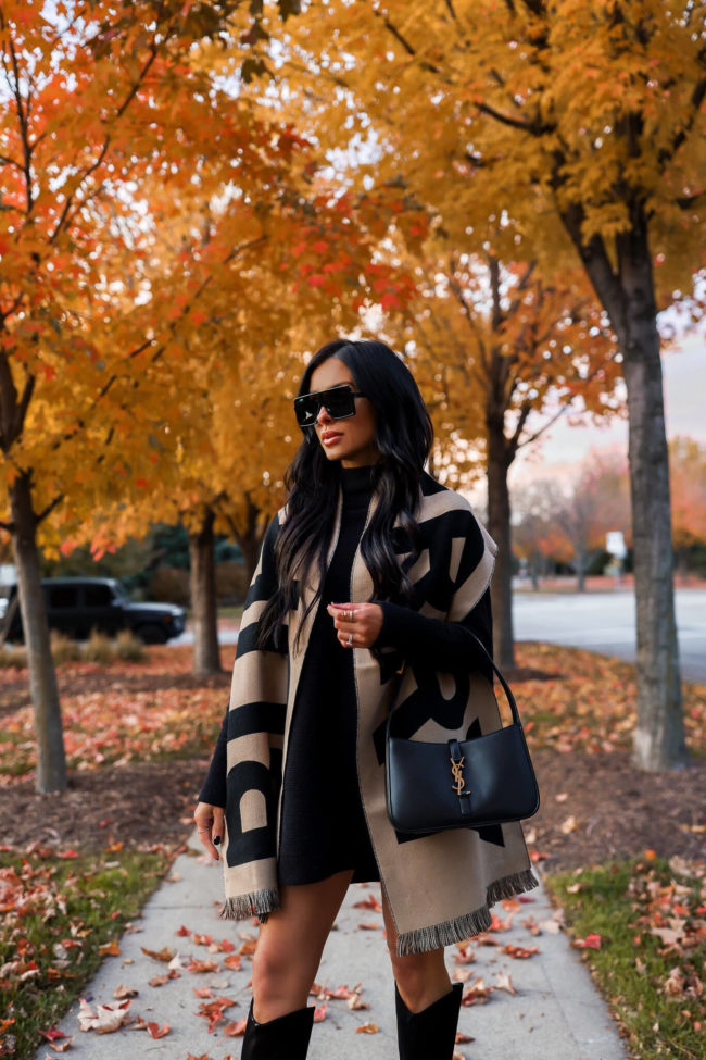 fashion blogger mia mia mine wearing a burberry scarf for fall from saks