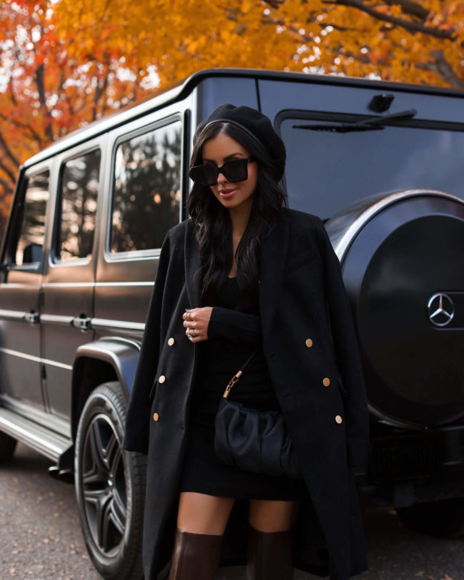 fashion blogger mia mia mine wearing a black wool coat from walmart
