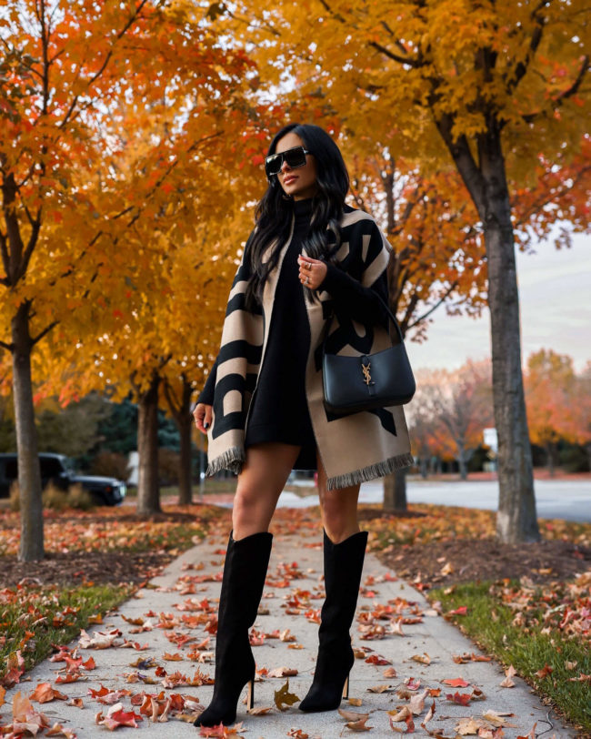 fashion blogger mia mia mine wearing a burberry scarf and free people sweater dress from saks