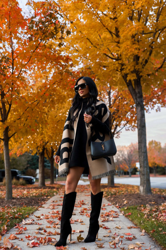 fashion blogger mia mia mine wearing a burberry scarf and free people sweater dress from saks