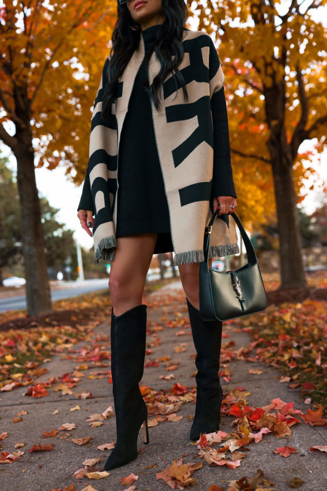 fashion blogger mia mia mine wearing schutz suede boots and a burberry scarf from saks fifth avenue