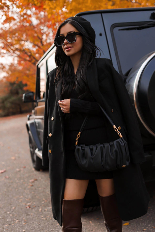 fashion blogger mia mia mine wearing a scoop black bag from walmart