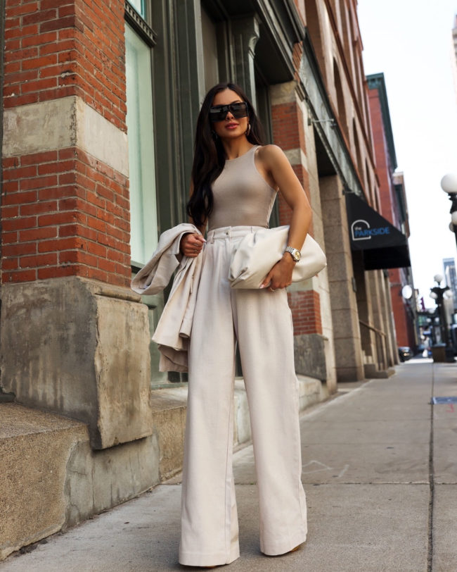 mia mia mine wearing wide leg pants from revolve