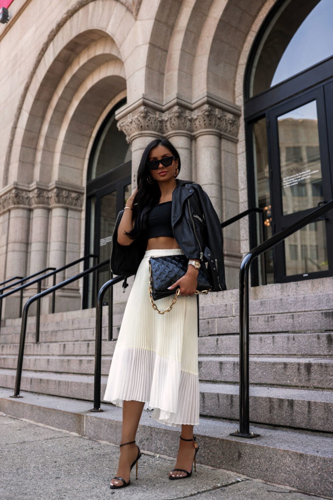 fashion blogger wearing a pleated skirt outfit for fall