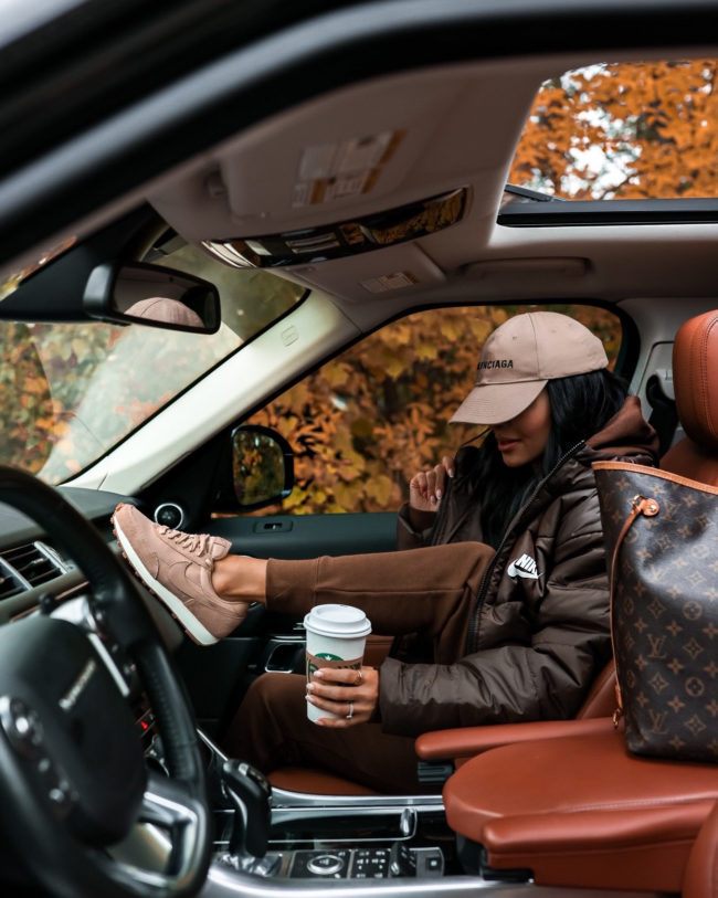fashion blogger wearing tan nike daybreak sneakers