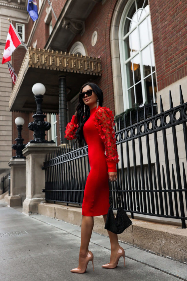 fashion blogger mia mia mine wearing a red holiday dress from walmart 