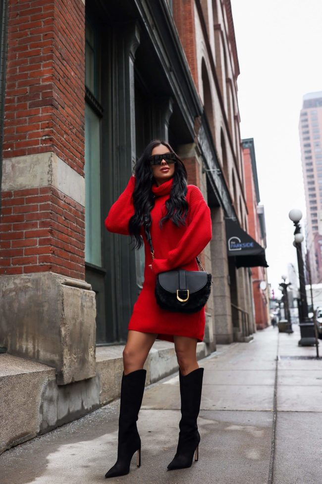 fashion blogger mia mia mine wearing a red sweater dress from walmart
