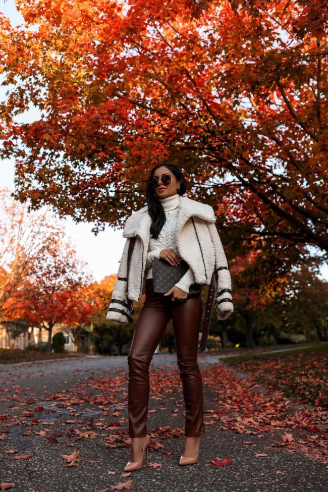 fashion blogger wearing a white and brown outfit for fall