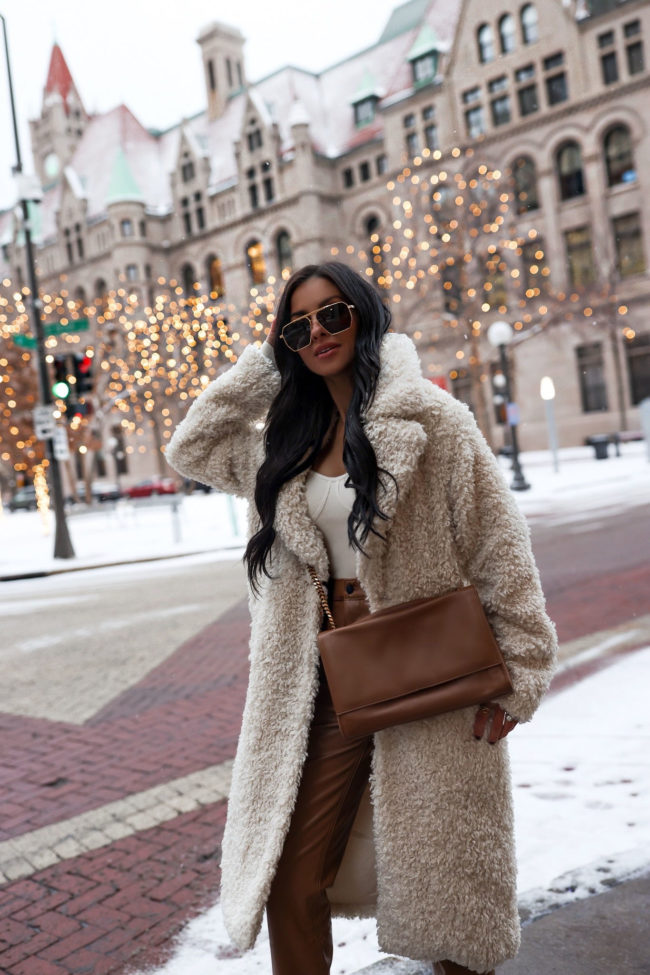 fashion blogger wearing a faux shearling coat from abercrombie