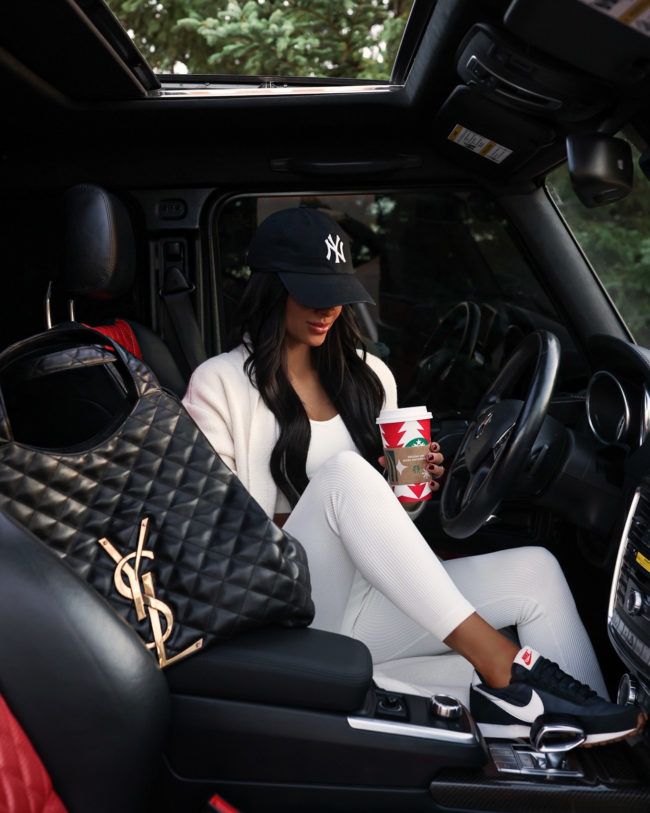 mia mia mine wearing a casual fall outfit with nike sneakers