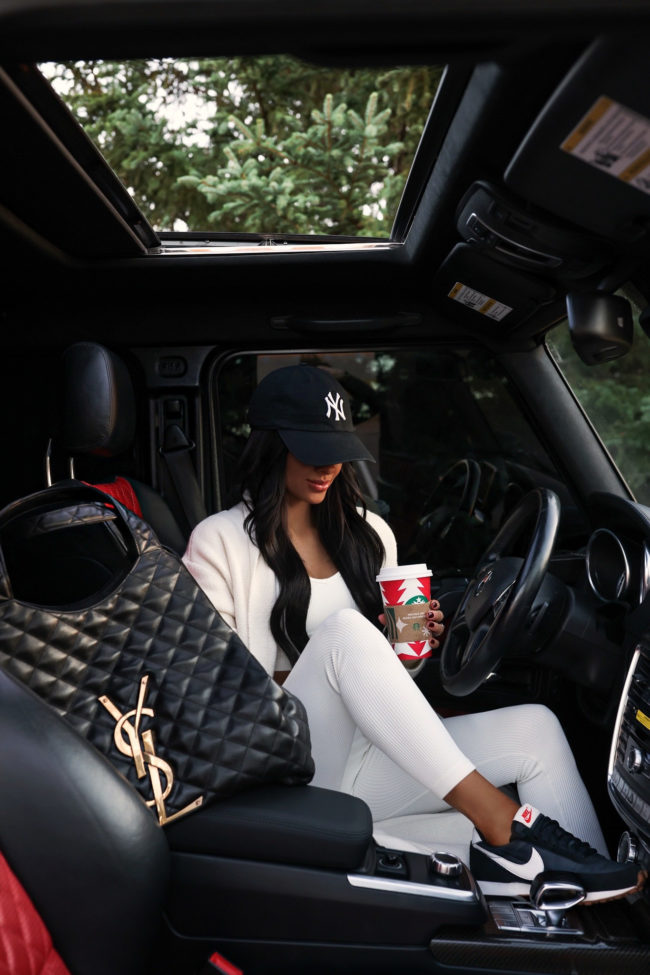 mia mia mine wearing a white lounge set by amazon and nike daybreak sneakers