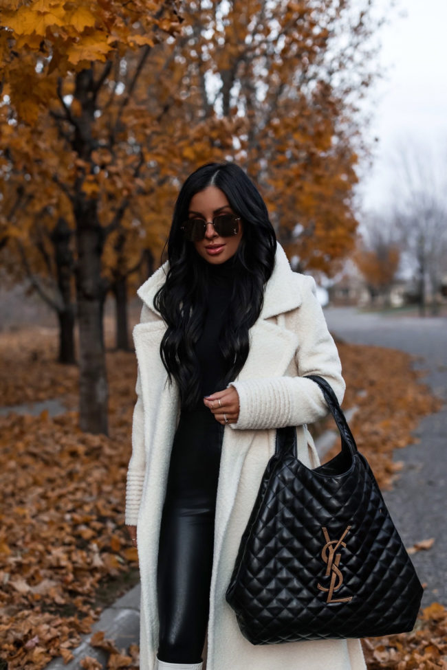 fashion blogger wearing a white shearling coat for winter