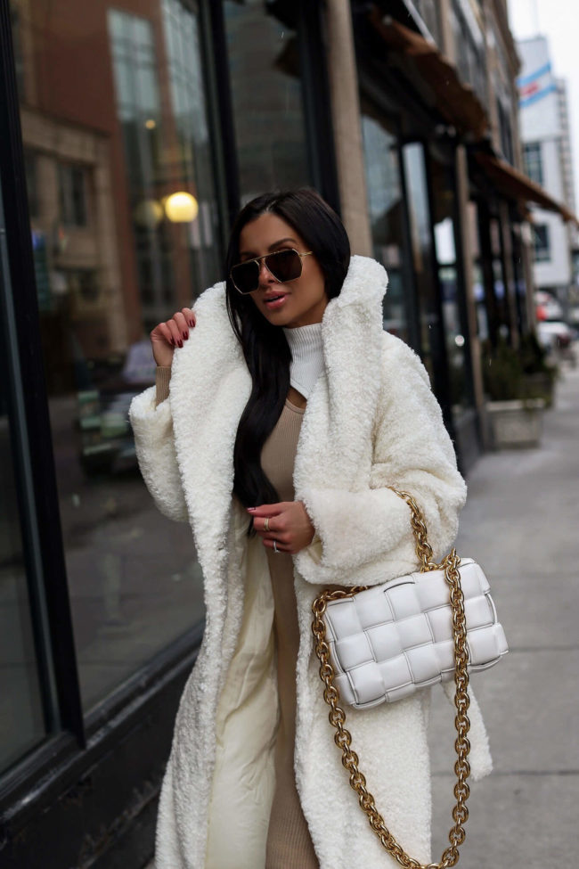 fashion blogger mia mia mine wearing a white cozy coat from walmart