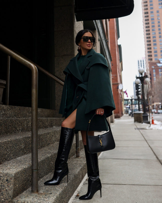 fashion blogger wearing croc effect boots for winter