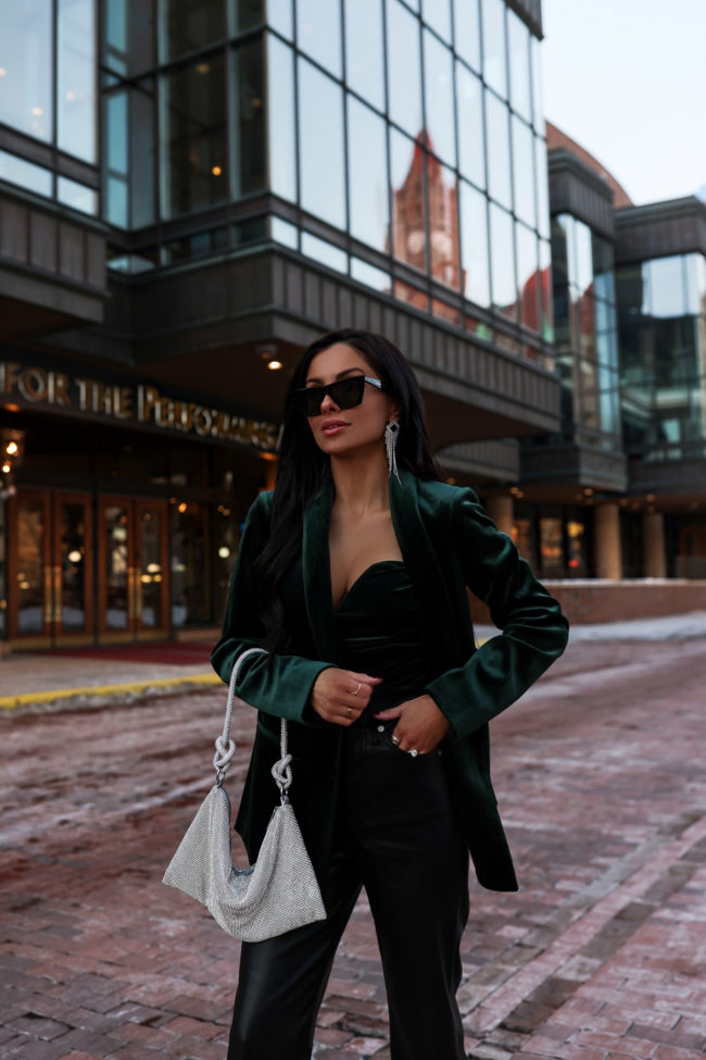 fashion blogger wearing a green velvet blazer from express
