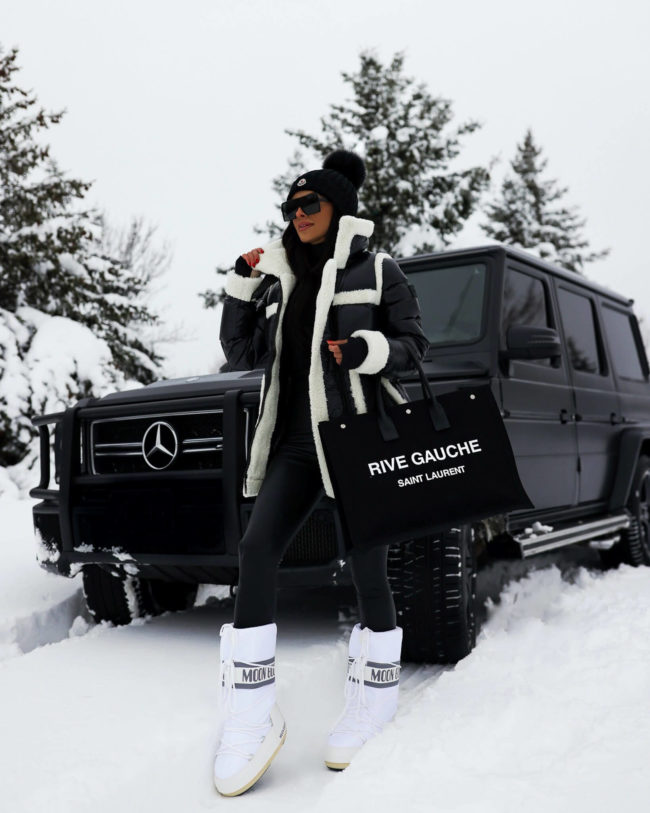 fashion blogger mia mia mine wearing black commando leggings in the snow