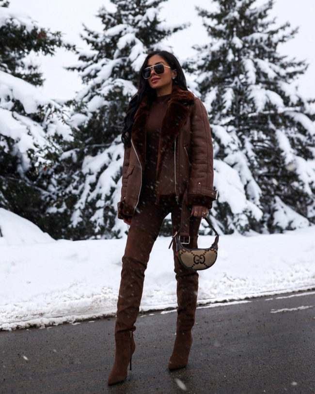 fashion blogger mia mia mine wearing a chocolate brown outfit for winter