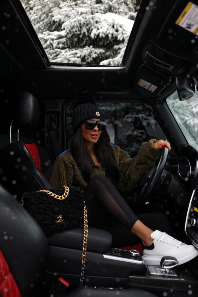 fashion blogger mia mia mine wearing a winter athleisure outfit from bloomingdale's