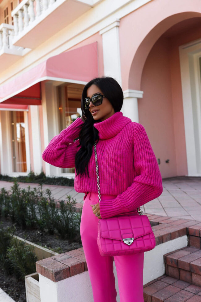 fashion blogger mia mia mine wearing a hot pink sweater and bag by michael kors