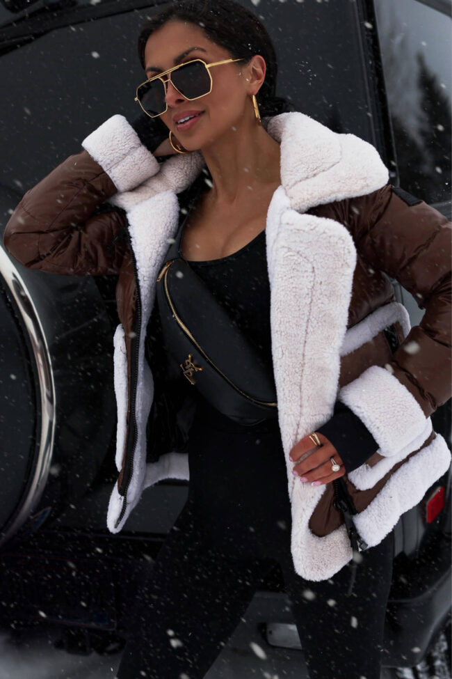 fashion blogger wearing a SAM shearling puffer jacket from saks