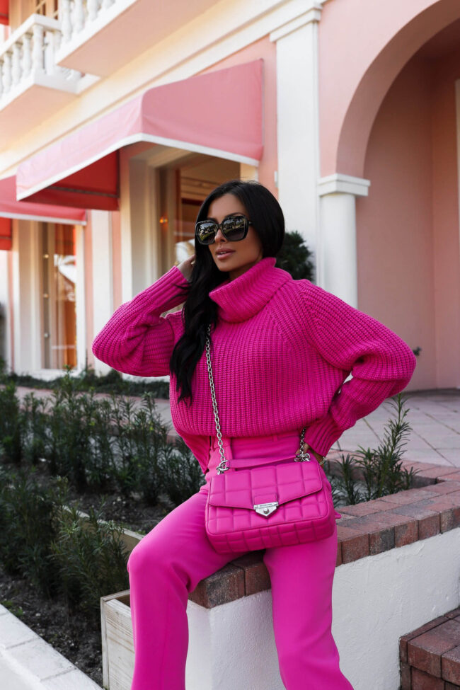 brunette fashion blogger wearing a hot pink outfit from michael kors