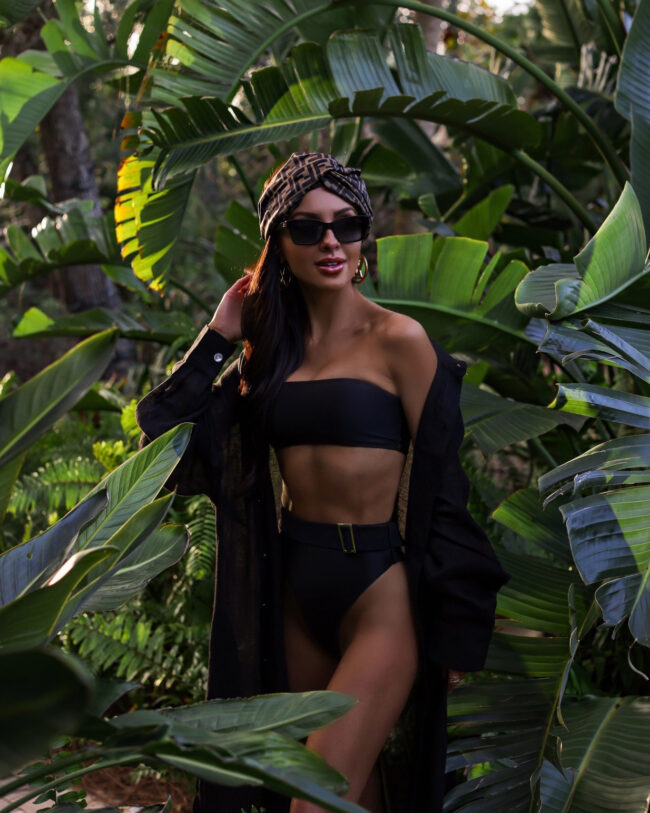 fashion blogger wearing a strapless black bikini in florida