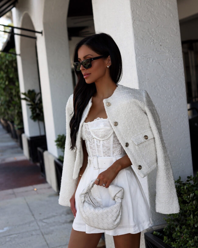 fashion blogger wearing a white lace corset by bardot