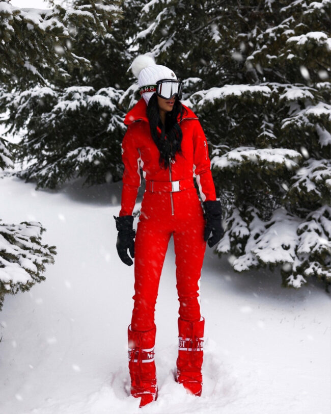 fashion blogger wearing a red ski outfit