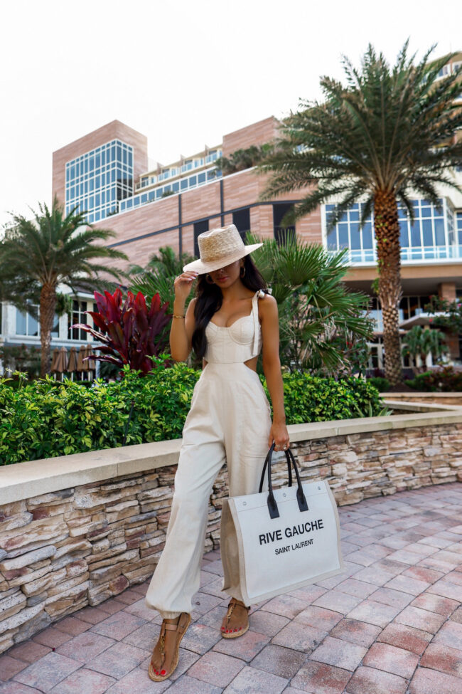 fashion blogger wearing a linen jumpsuit in florida