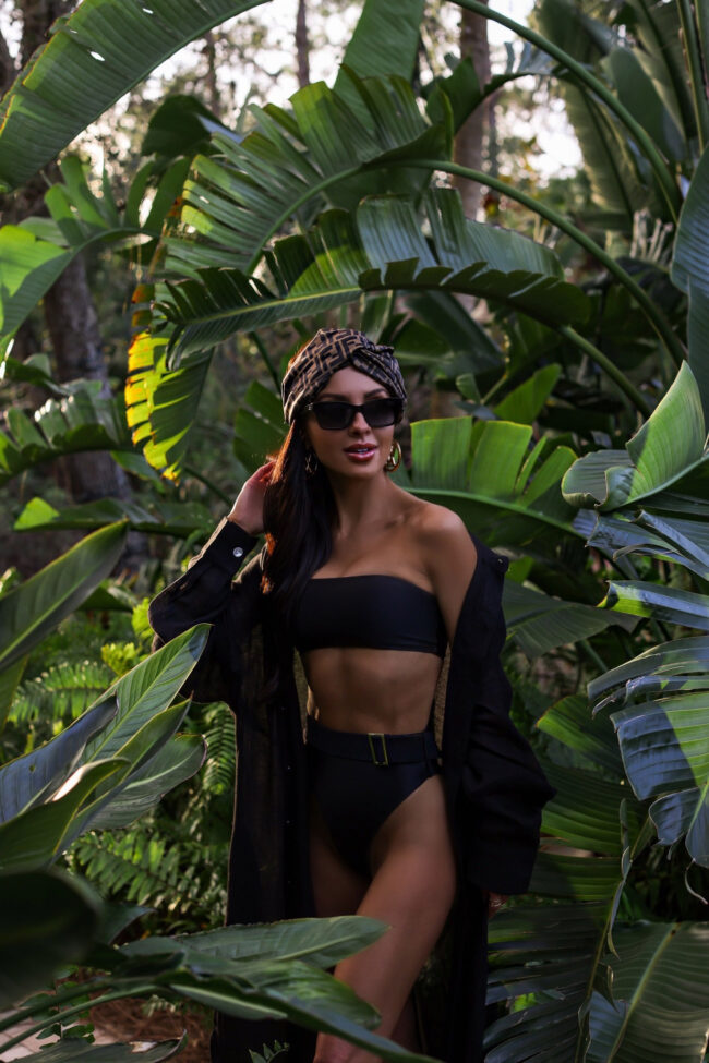 fashion blogger mia mia mine wearing a black bikini and linen coverup dress