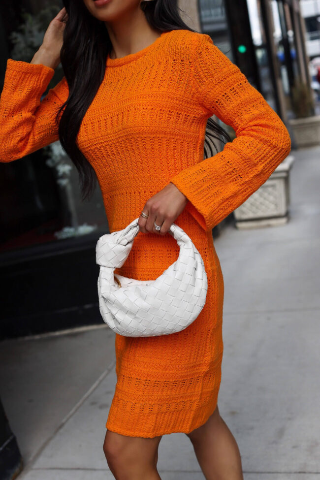 fashion blogger mia mia mine wearing an orange mini dress