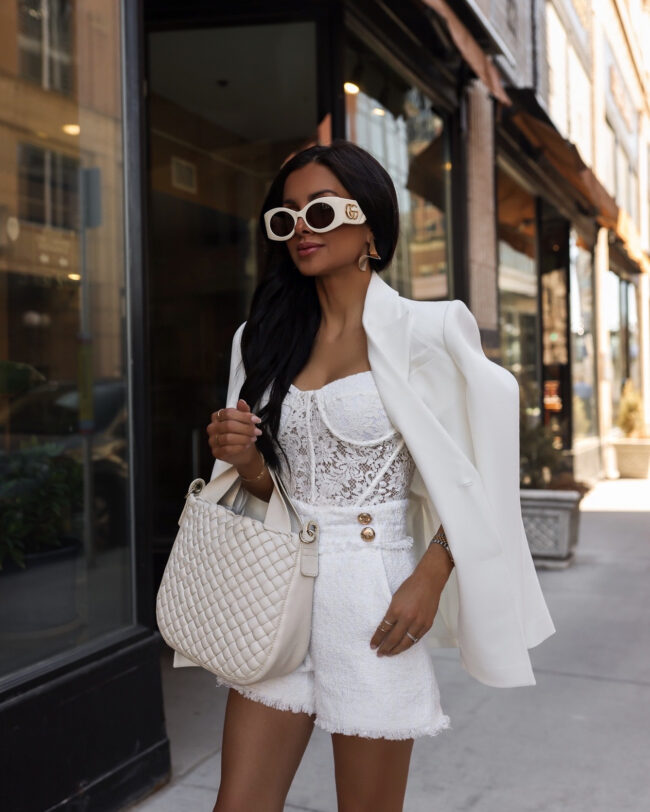 fashion blogger wearing a white lace corset and tweed shorts