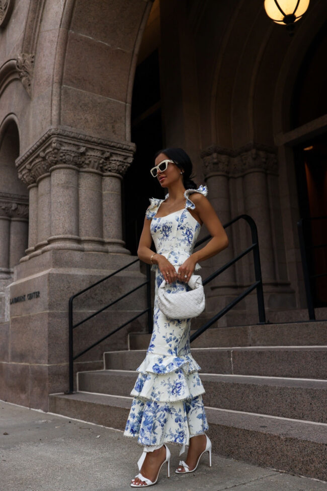 fashion blogger mia mia mine wearing a blue floral dress