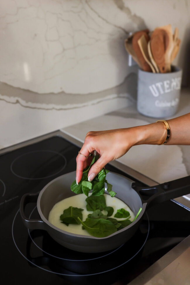 woman cooking an omelette in an always pan mini