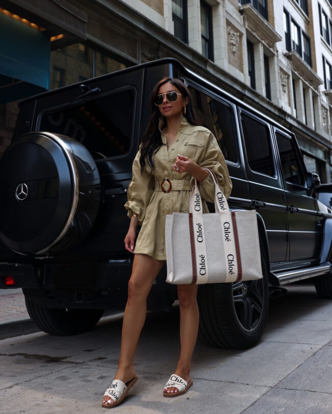 fashion blogger mia mia mine wearing a zimmermann romper and chloe woody slides