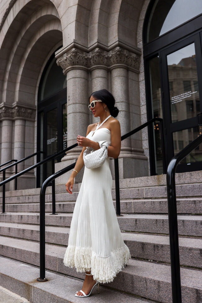 fashion blogger mia mia mine wearing a white maxi dress from express