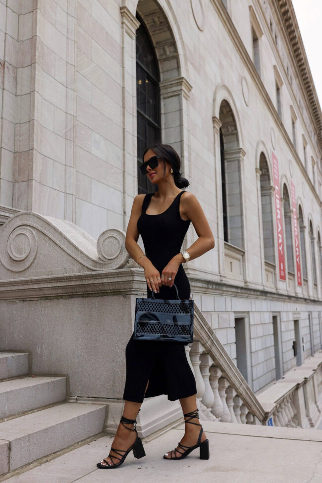 fashion blogger mia mia mine wearing a black knit dress and heels from walmart