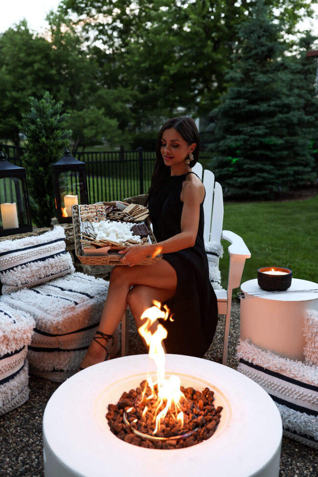 mia mia mine at an outdoor firepit with a smores board