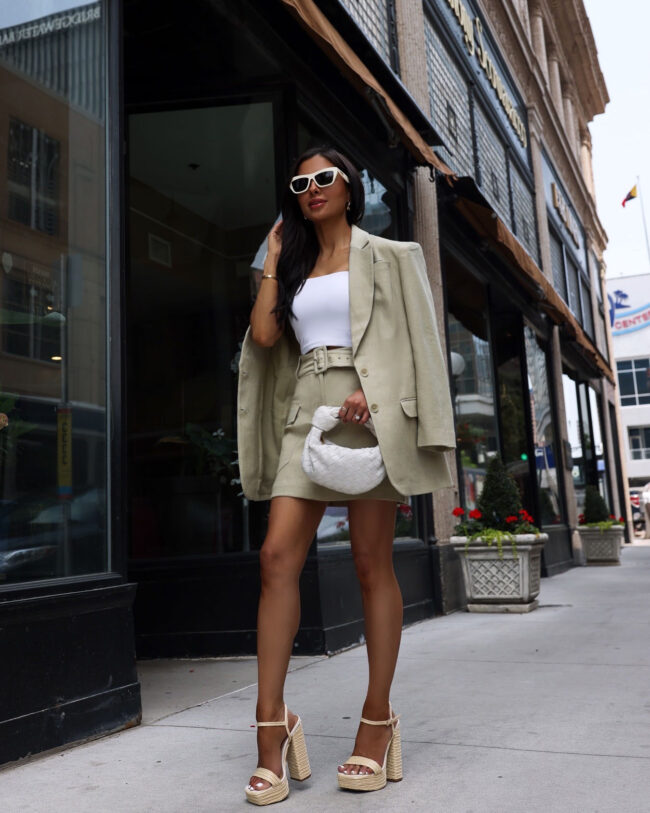 fashion blogger mia mia mine wearing an express summer suit