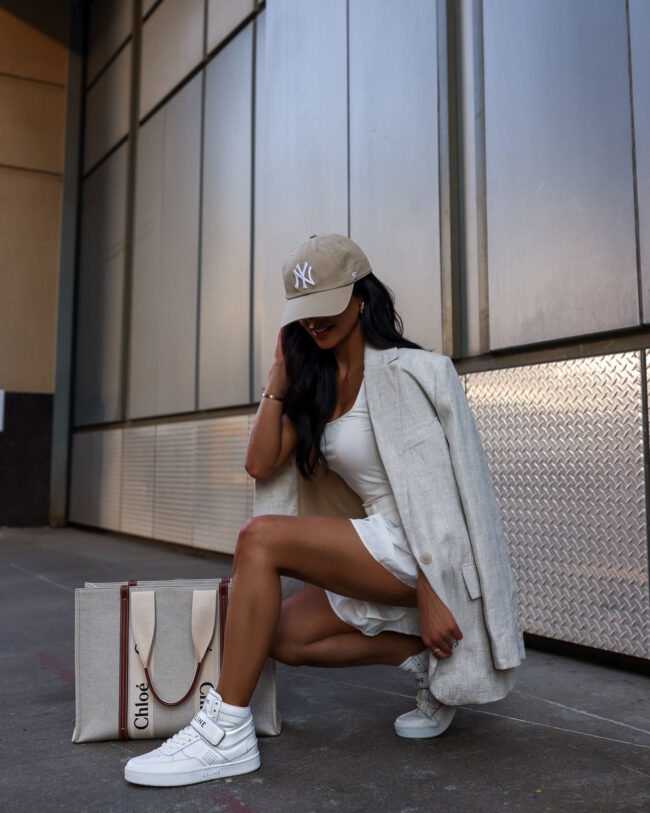 fashion blogger mia mia mine wearing celine high top sneakers