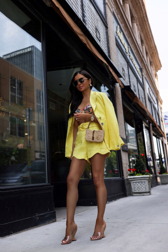 fashion blogger wearing a yellow short suit by farm rio