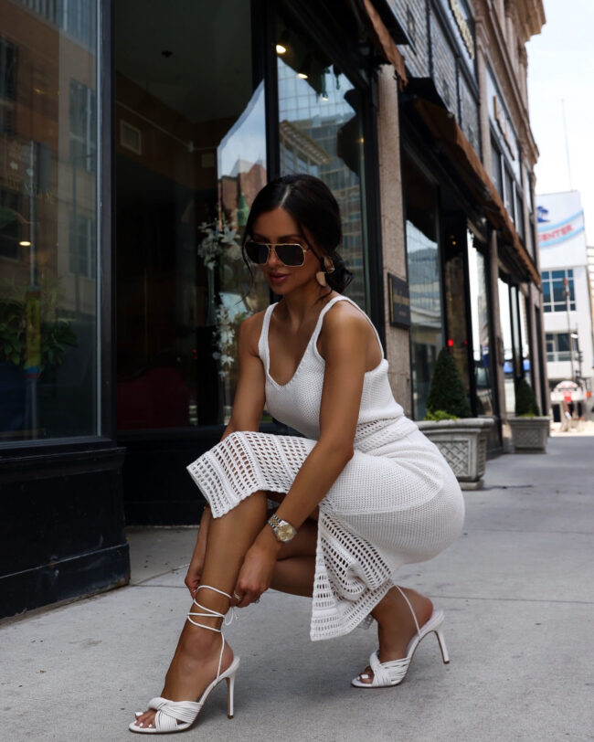 fashion blogger wearing white lace up sandals by marc fisher