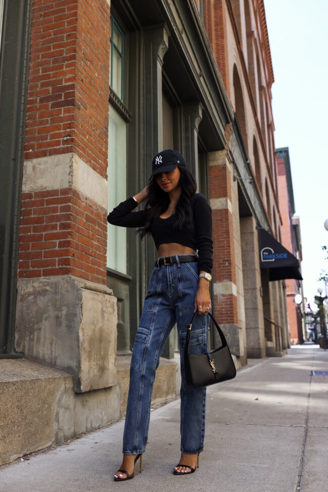 mia mia mine wearing agolde cargo jeans with a crop top