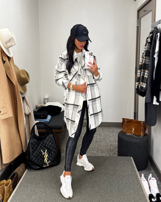 fashion blogger mia mia mine wearing a plaid shacket and new balance 327 sneakers