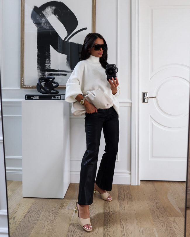 fashion blogger mia mia mine wearing a white allsaints sweater and coated jeans from the nsale