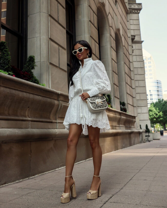 fashion blogger wearing a white eyelet dress from amazon