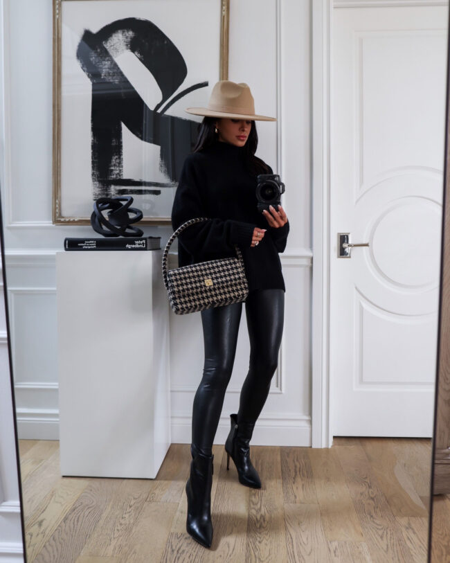 fashion blogger wearing black booties and faux leather leggings from the nordstrom anniversary sale