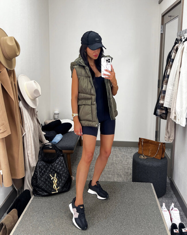 fashion blogger mia mia mine wearing a knit romper and a puffer vest from the NSALE